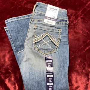 Never worn Ariat mid rise boot cut jeans. Size 25reg
